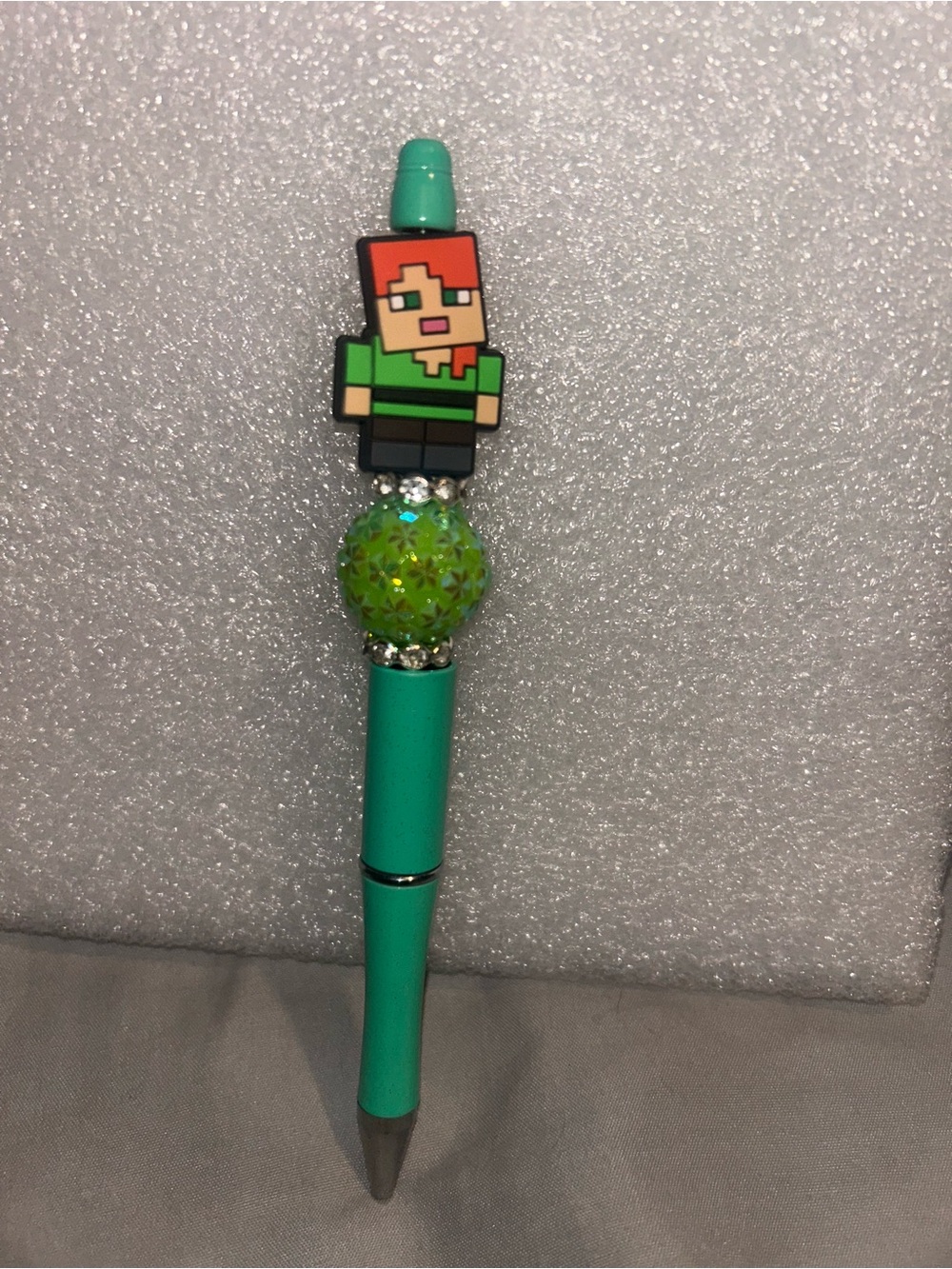 Hand Crafted Teal Pen with Pixel Doll Topper and Sparkle Bead
